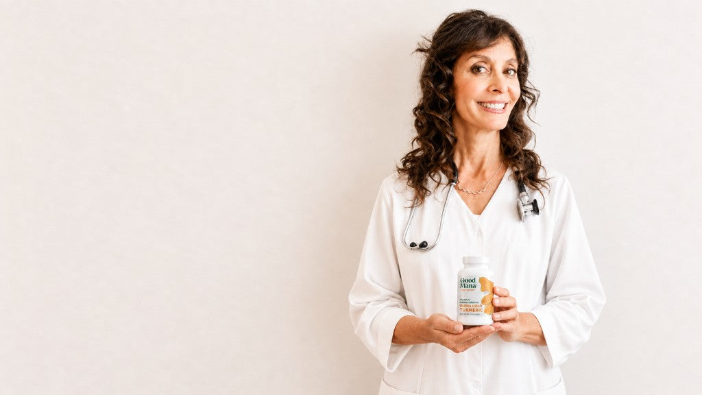 Dr. Joy holding one bottle of Good Mana ʻŌlena Gold
